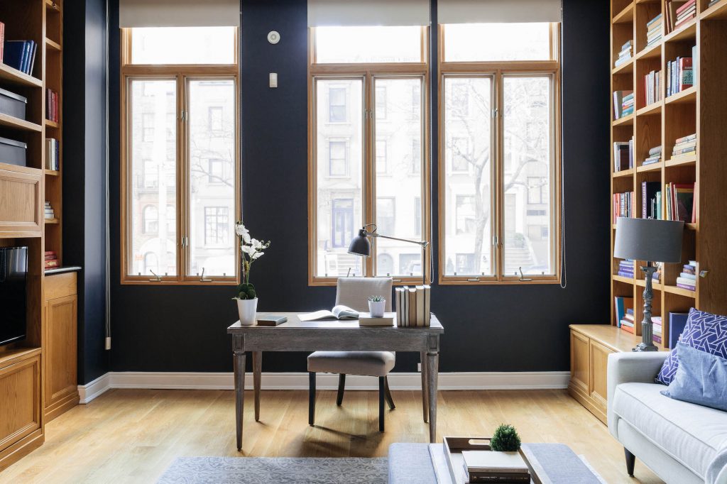 large home office with wall-to-wall bookcases