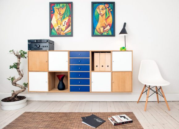 A living room console with multiple forms of storage including drawers, shelves, and box inserts.