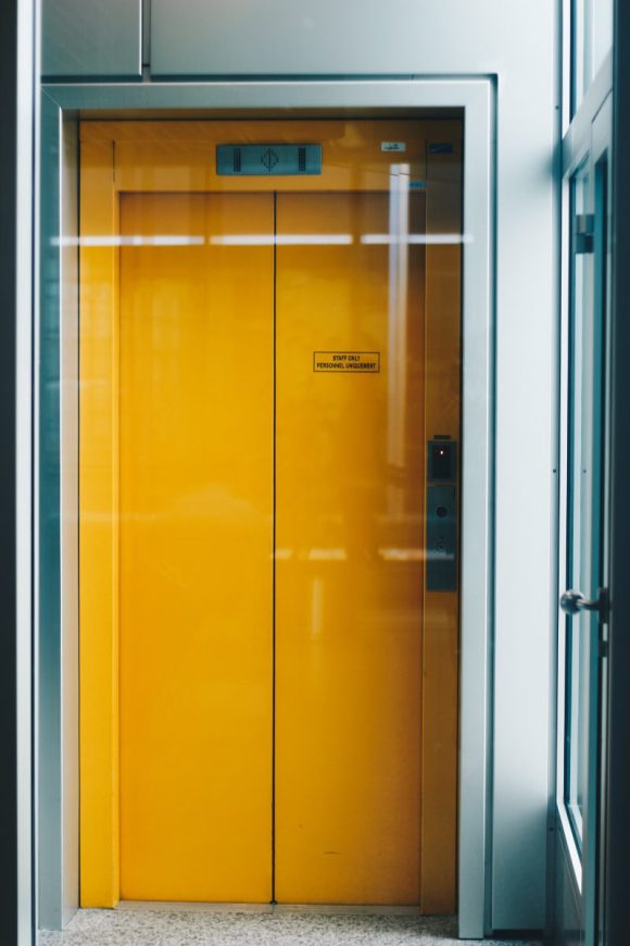 A closed yellow elevator