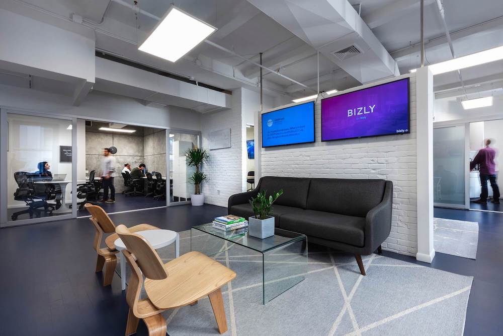 Office reception area with sofa and chairs